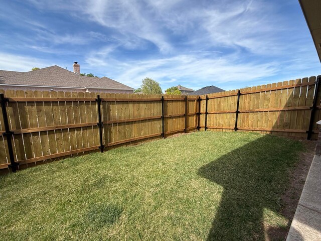view of yard with a patio and fence