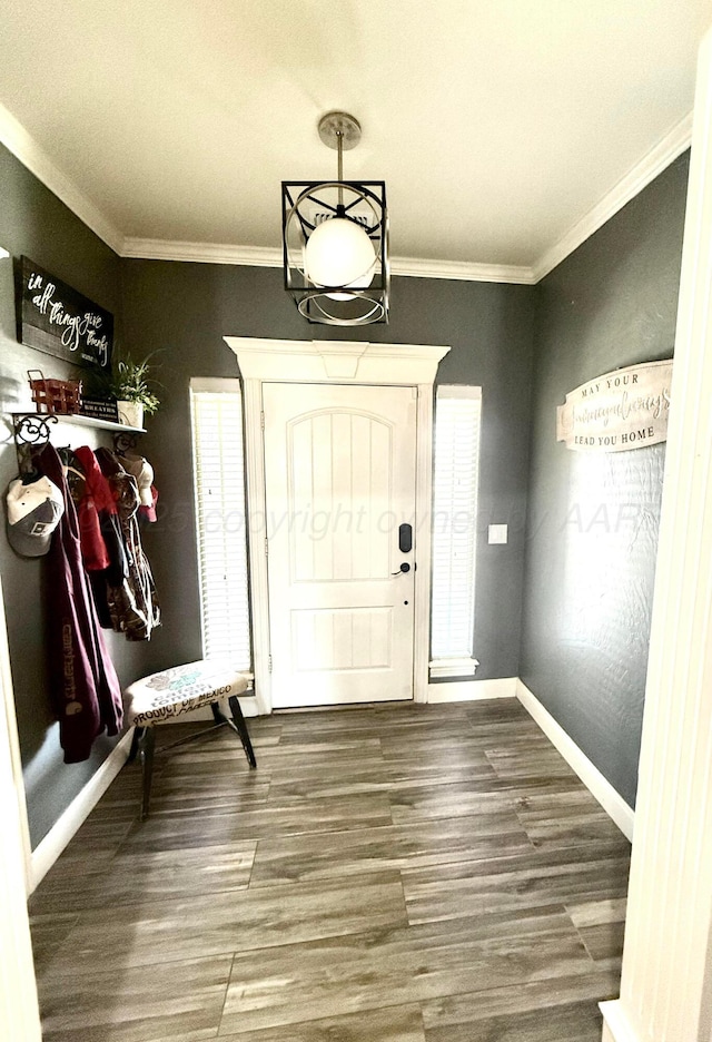mudroom featuring baseboards, crown molding, and wood finished floors