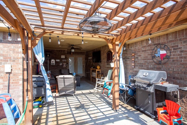 view of patio with a pergola, ceiling fan, and a grill