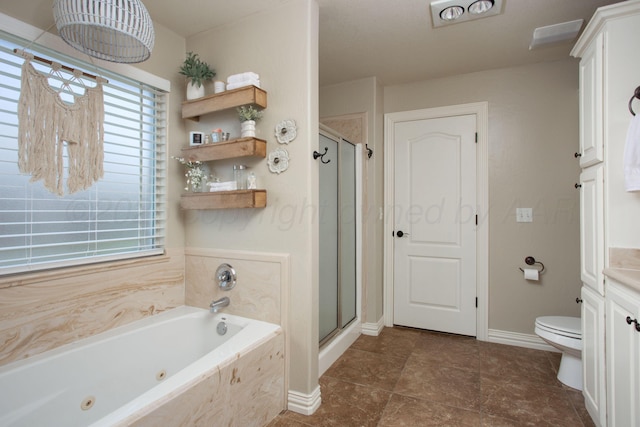 bathroom featuring tile patterned floors, toilet, baseboards, a whirlpool tub, and a shower stall