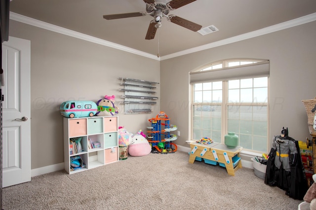 rec room featuring carpet floors, ornamental molding, and ceiling fan