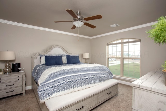 carpeted bedroom with ceiling fan and crown molding