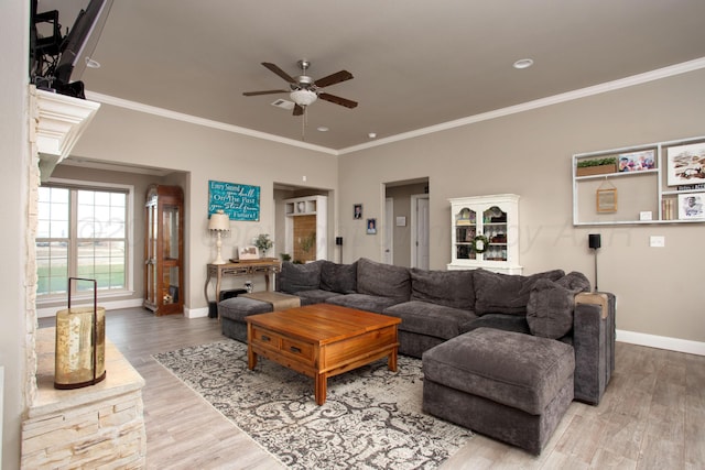 living room featuring hardwood / wood-style flooring and ornamental molding