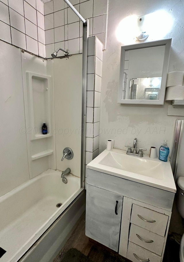 full bathroom featuring vanity, toilet, and bathing tub / shower combination