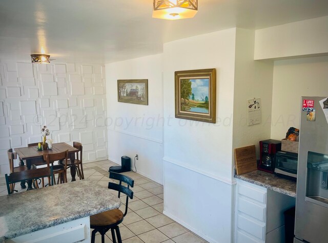 dining room with light tile patterned flooring