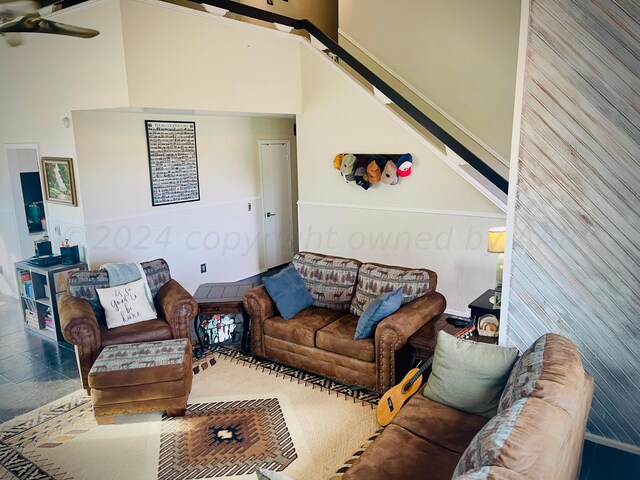 living room featuring a towering ceiling