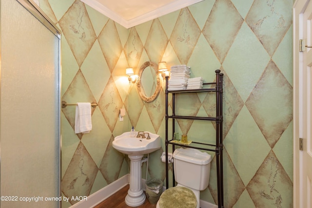 1607 S Harrison St, Amarillo, TX 79102 - half bathroom with wood finished floors, toilet, and ornamental molding