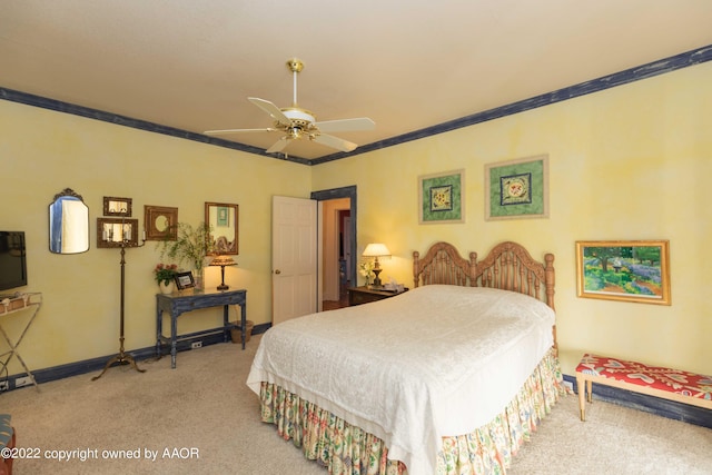 bedroom with carpet floors, ceiling fan, and crown molding