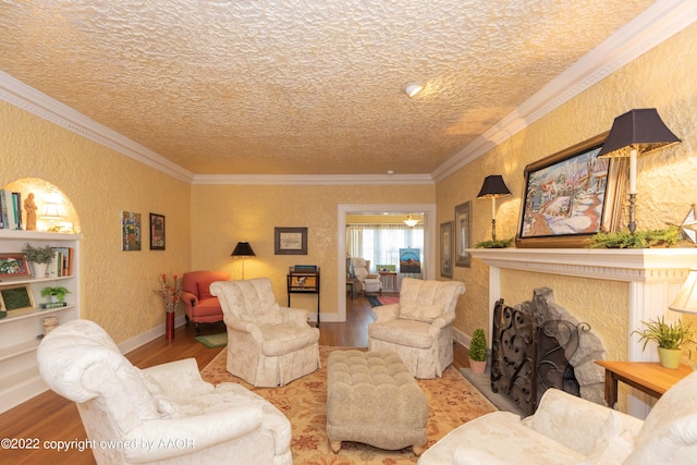 1607 S Harrison St, Amarillo, TX 79102 - living area with wood finished floors, ornamental molding, a fireplace, a textured wall, and a textured ceiling