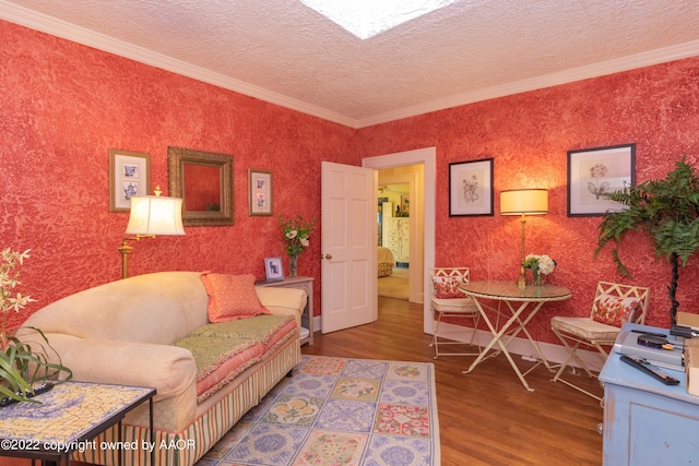 interior space with hardwood / wood-style floors, a textured ceiling, and ornamental molding