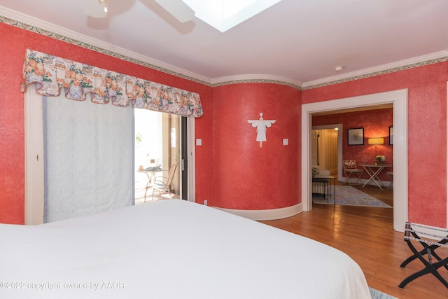 1607 S Harrison St, Amarillo, TX 79102 - bedroom with wood finished floors, crown molding, a skylight, and a ceiling fan