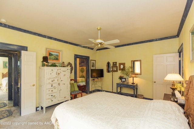 1607 S Harrison St, Amarillo, TX 79102 - bedroom featuring ornamental molding, a ceiling fan, and light colored carpet