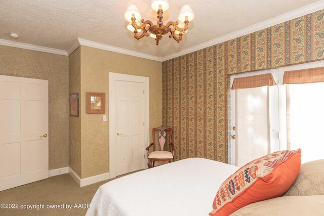 bedroom with a chandelier, a textured ceiling, carpet, and crown molding