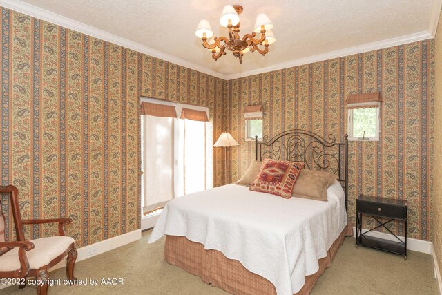 1607 S Harrison St, Amarillo, TX 79102 - bedroom featuring a chandelier, ornamental molding, carpet floors, and baseboards