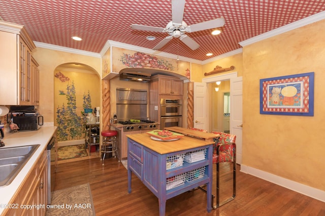 kitchen featuring dark wood-type flooring, wooden counters, ceiling fan, and crown molding