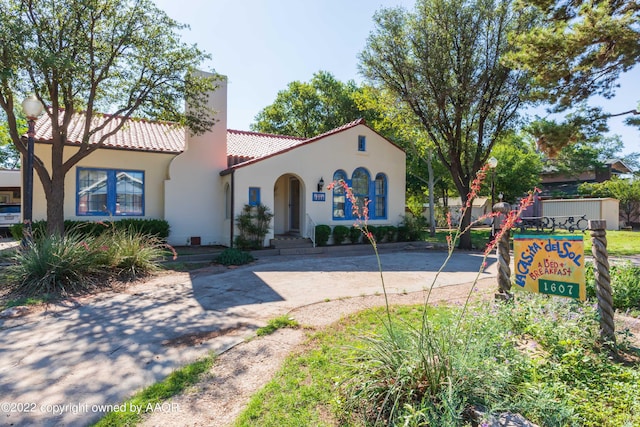 1607 S Harrison St, Amarillo, TX 79102 - mediterranean / spanish home with a tile roof, stucco siding, and a chimney