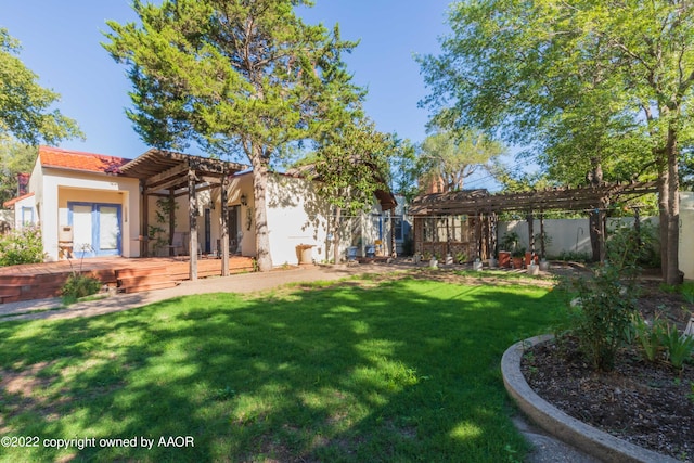 view of yard featuring a pergola and a deck