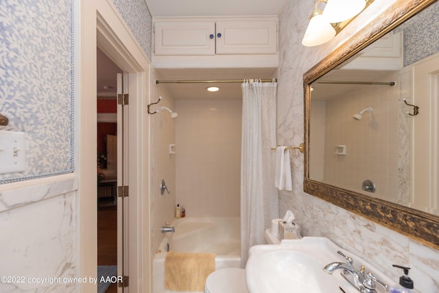 1607 S Harrison St, Amarillo, TX 79102 - full bathroom with wallpapered walls, shower / tub combo with curtain, toilet, and a sink