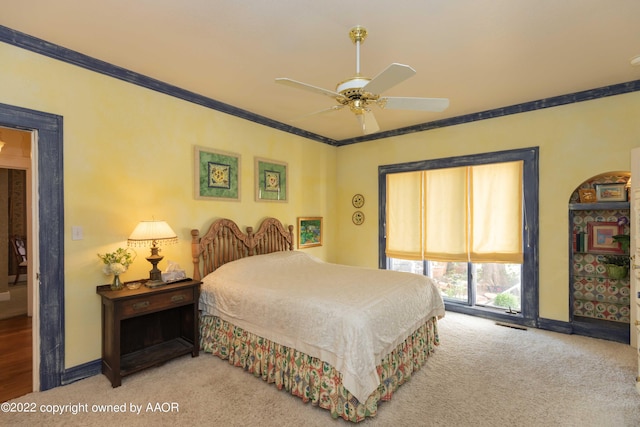 1607 S Harrison St, Amarillo, TX 79102 - bedroom featuring carpet flooring, baseboards, crown molding, access to exterior, and ceiling fan