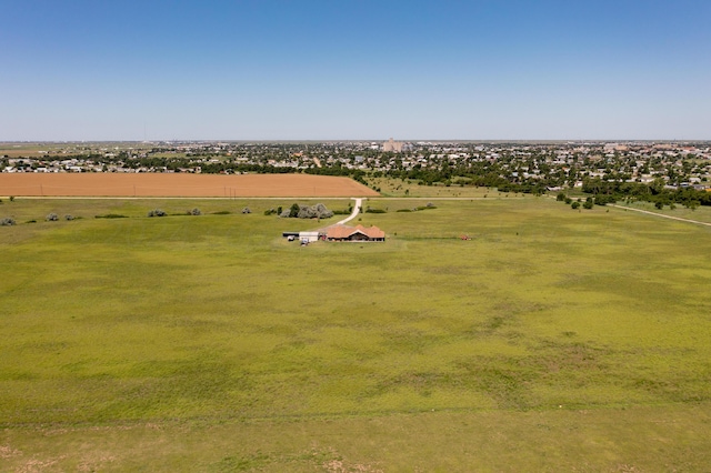 birds eye view of property with a rural view