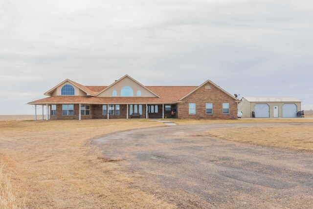 view of front of property featuring a garage and covered porch