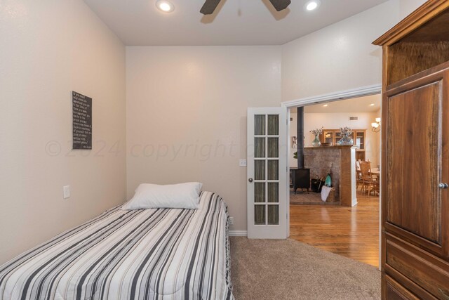 bedroom featuring hardwood / wood-style flooring and ceiling fan