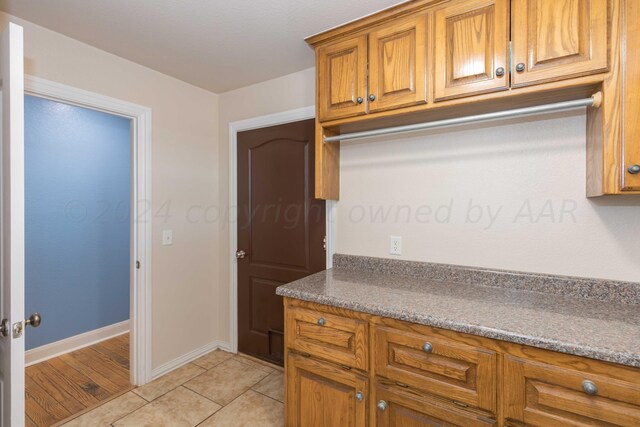 kitchen with light tile patterned floors