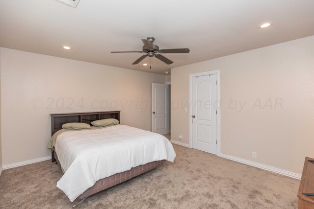 bedroom with ceiling fan and carpet floors