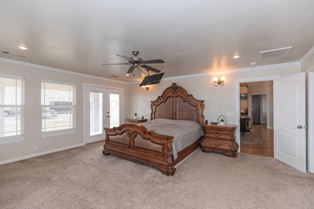 carpeted bedroom featuring a textured ceiling, french doors, ceiling fan, and crown molding