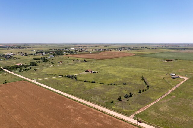 birds eye view of property with a rural view