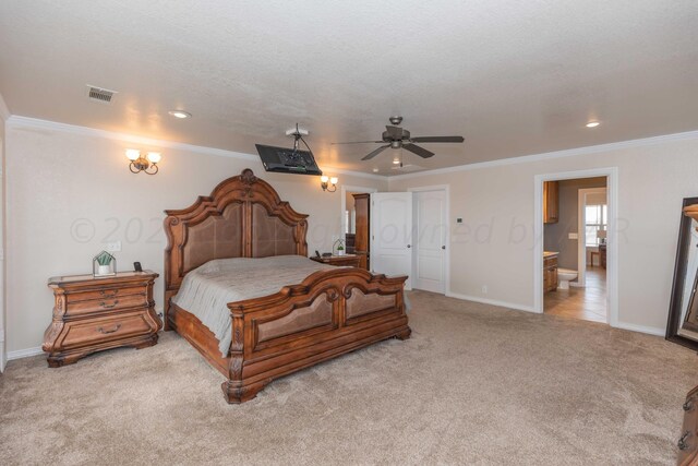 carpeted bedroom with ensuite bathroom, ceiling fan, a textured ceiling, and crown molding