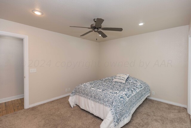 carpeted bedroom featuring ceiling fan