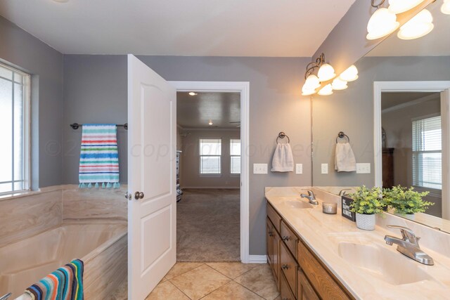 bathroom featuring vanity, a wealth of natural light, and tile patterned flooring