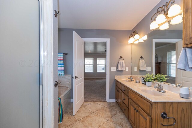 bathroom featuring a bath, vanity, and tile patterned floors