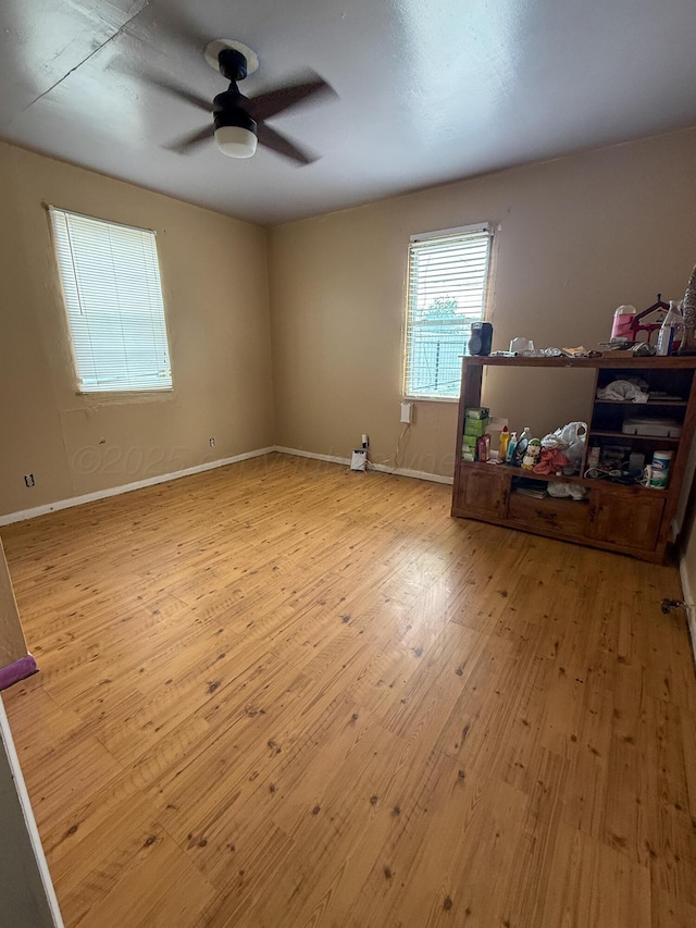 600 S Williston St, White Deer, TX 79097 - unfurnished room with baseboards, a ceiling fan, and wood finished floors