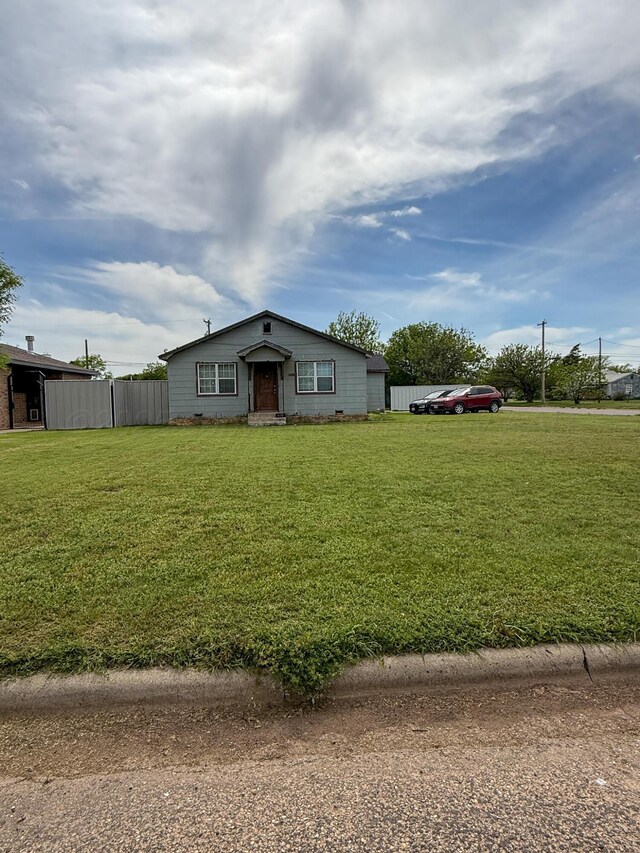 600 S Williston St, White Deer, TX 79097 - view of front of home with fence and a front yard