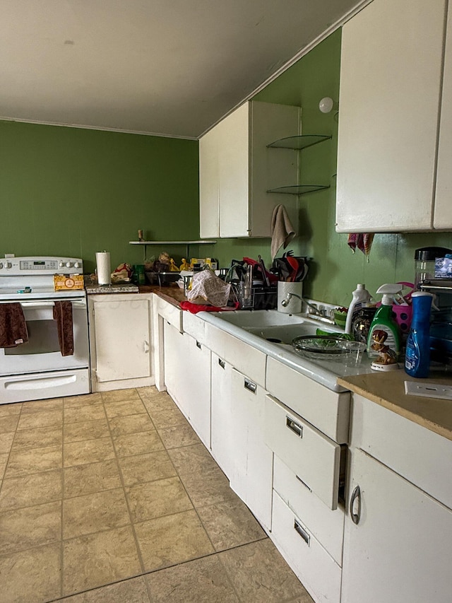 600 S Williston St, White Deer, TX 79097 - kitchen featuring white range with electric stovetop and white cabinets