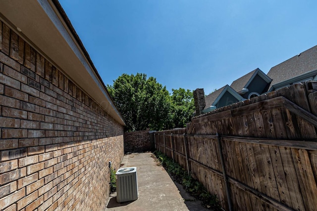 7402 Park Ridge Dr, Amarillo, TX 79119 - view of home's exterior with brick siding and central AC