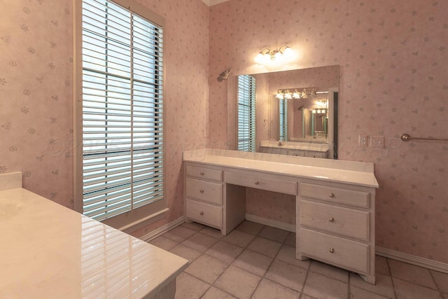 7402 Park Ridge Dr, Amarillo, TX 79119 - full bath featuring vanity, baseboards, tile patterned flooring, and wallpapered walls