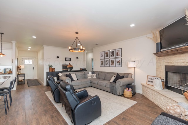 25 Nicci Ln, Canyon, TX 79015 - living area with a chandelier, dark wood-style flooring, a fireplace, baseboards, and recessed lighting