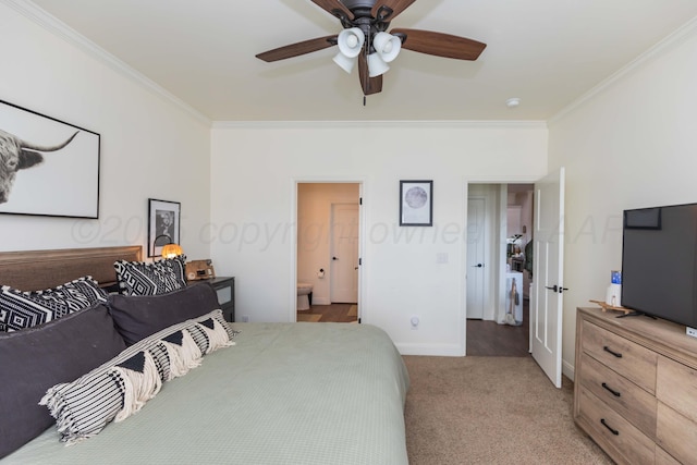 25 Nicci Ln, Canyon, TX 79015 - bedroom with ornamental molding, carpet flooring, baseboards, ensuite bath, and ceiling fan