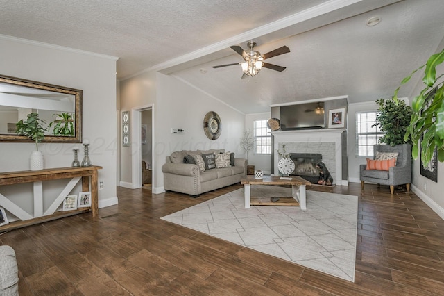 living room with hardwood / wood-style flooring, plenty of natural light, and vaulted ceiling