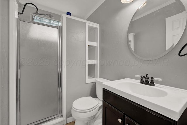 bathroom with crown molding, a shower stall, toilet, and vanity