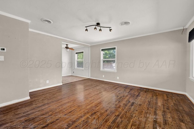 unfurnished room featuring ornamental molding, baseboards, wood finished floors, and a ceiling fan