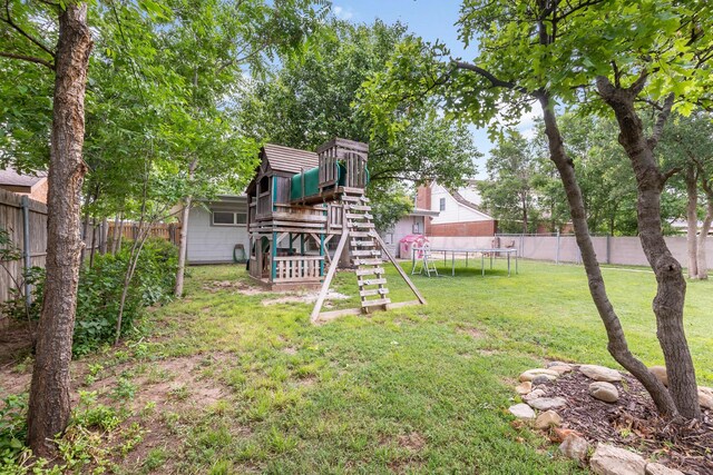 123 Bellaire Ave, Dumas, TX 79029 - view of yard featuring a trampoline and a playground