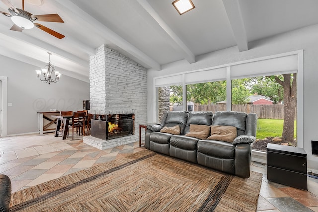 123 Bellaire Ave, Dumas, TX 79029 - living room with plenty of natural light, a ceiling fan, a chandelier, and a stone fireplace