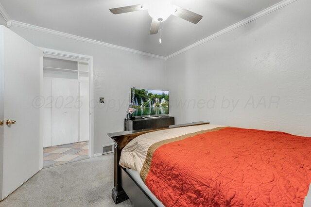 123 Bellaire Ave, Dumas, TX 79029 - bedroom with light colored carpet, crown molding, and a ceiling fan