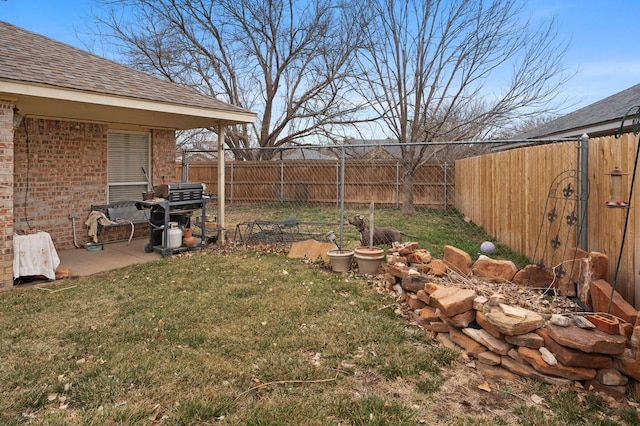 view of yard with a fenced backyard