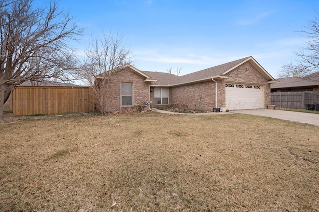 single story home with concrete driveway, brick siding, a front yard, and fence