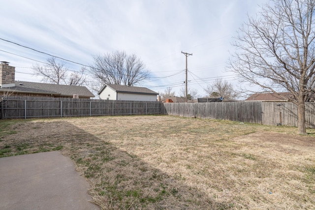 view of yard with a fenced backyard